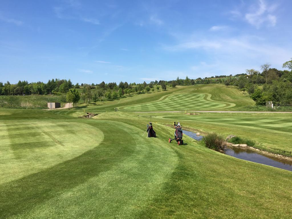 9 Holes of Golf, Breakfast Roll & Hot Drink