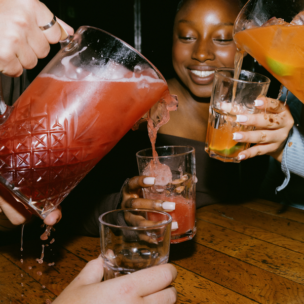 BOTTLE OF HOUSE SPIRIT AND COCKTAIL PITCHER